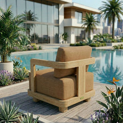 Anderson Teak Granada deep seating armchair with plush cushions in a garden setting, available in nine designer colors.