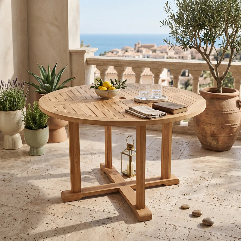 Anderson Teak Tosca 47-inch round table with wooden finish, perfect for indoor or outdoor dining and gatherings.