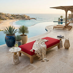 Outdoor daybed by Anderson Teak with a sleek teak wood frame, featuring plush cushions in designer colors for garden lounging.