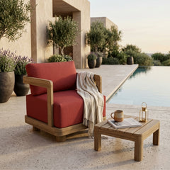 Anderson Teak Granada Deep Seating Armchair in outdoor patio setting, showing deep cushioned lounge chair with colorful fabric options.