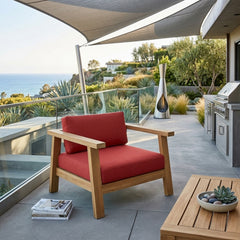 Anderson Teak Palermo teak wood deep seating armchair, outdoor accent chair with plush cushions in natural garden setting.