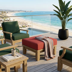 Luxury outdoor Anderson Teak ottoman with cushion, featuring a sleek teak design and available in nine designer colors.