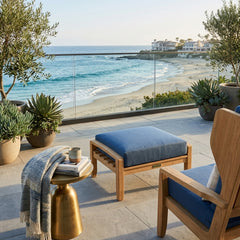Luxury Anderson Teak NATSEPA outdoor ottoman with a teak wood finish, shown in a designer color, ideal for patio seating.