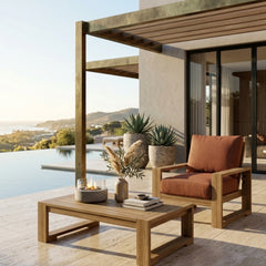 Anderson Teak Capistrano deep seating accent armchair in outdoor patio setting, available in 9 designer colors for garden relaxation
