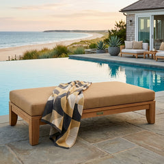 Riviera 60-inch outdoor daybed by Anderson Teak with A-grade teak wood, shown in a garden lounge setting with cushions and designer colors.