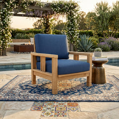 Southbay teak wood accent armchair by Anderson Teak, outdoor deep seating with plush cushions in a garden setting.