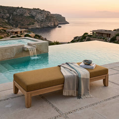Outdoor daybed by Anderson Teak with A-grade teak wood, featuring plush cushions and a modern design for garden lounge relaxation.