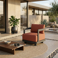 Anderson Teak Granada aluminum swivel armchair with deep seating, shown in a designer color, ideal for patio and garden outdoor use.
