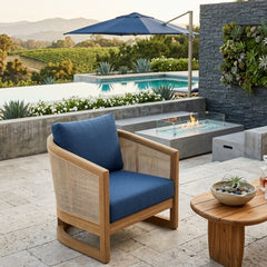 Anderson Teak Catania Deep Seating Armchair with plush cushions in a modern outdoor patio setting, available in 9 designer colors.