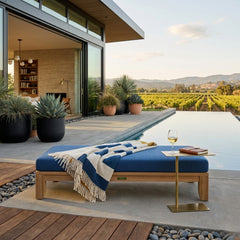Riviera 60-inch outdoor daybed by Anderson Teak with A-grade teak wood, designed for garden lounging, in a natural outdoor setting.