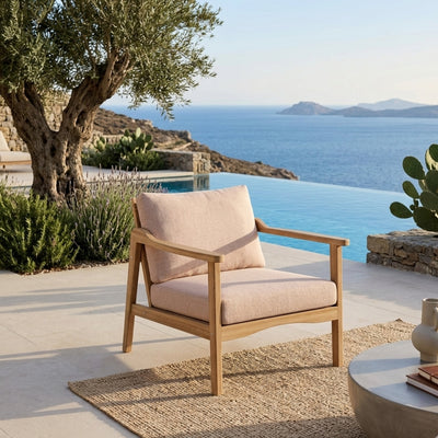 Anderson Teak Amalfi deep seating armchair in outdoor patio setting, available in 9 designer colors for garden and outdoor lounging.