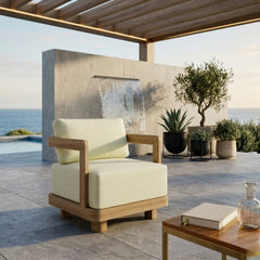 Anderson Teak Granada deep seating armchair with outdoor luxury design, shown in a stylish patio setting with vibrant color options.