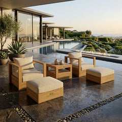 Set of two teak wood outdoor armchairs and two ottomans from Anderson Teak in natural finish, designed for garden lounge seating.