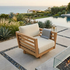 Anderson Teak Cordoba deep seating swivel armchair with plush cushions in outdoor patio setting, available in nine designer colors.