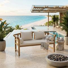 Anderson Teak Brisbane deep seating outdoor sofa with plush cushions in a garden setting, available in nine designer colors.