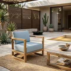 Anderson Teak JUNUS Lounge teak wood armchair with deep outdoor seating, shown in a designer color, perfect for patio and garden.
