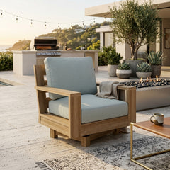 Anderson Teak Madera swivel armchair with deep outdoor seating, shown in a designer color, ideal for patio and garden settings.