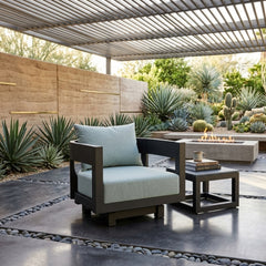 Anderson Teak Coronado aluminum swivel armchair with deep outdoor seating, available in nine designer colors for patio and garden use.