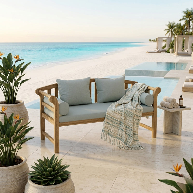 Anderson Teak Brisbane deep seating outdoor sofa with plush cushions in a luxurious garden setting, available in nine designer colors.