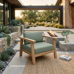 Anderson Teak Palermo teak wood deep seating accent armchair with plush cushions in a garden setting, available in 9 designer colors.