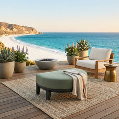 Coronado Aluminum Ottoman by Anderson Teak in a stylish outdoor setting, showcasing its sleek design and 9 available designer colors.