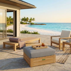 Anderson Teak Copacabana outdoor teak ottoman in natural wood finish with a cushioned top, designed for patio relaxation.