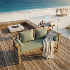 Anderson Teak Brisbane deep seating bench sofa in a stylish outdoor lounge setting with vibrant cushions.