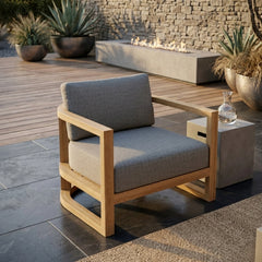 Anderson Teak JUNUS outdoor teak armchair with deep lounge seating, available in 9 designer colors, ideal for patio and garden.