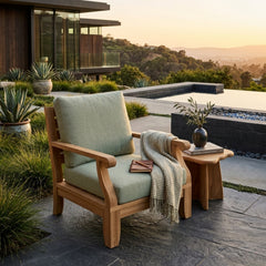 Anderson Teak Riviera modular teak wood armchair with deep seating, shown in a designer color for outdoor patio and garden use.