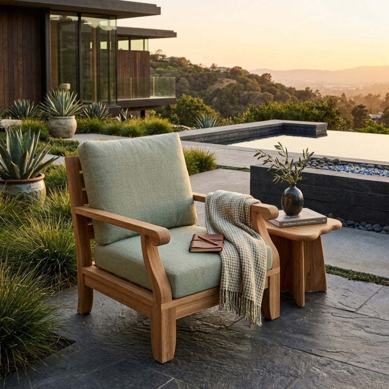 Anderson Teak Riviera modular teak wood armchair with deep seating, shown in a designer color for outdoor patio and garden use.