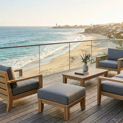 Luxury outdoor Anderson Teak ottoman with cushion in a designer color, perfect as a patio footstool or versatile outdoor seating.