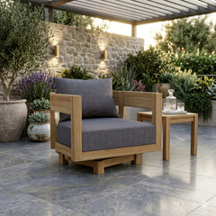 Anderson Teak Coronado A-Grade Teak Swivel Armchair with deep outdoor seating in a modern patio setting.