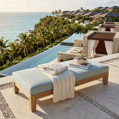 Riviera 60-inch outdoor daybed by Anderson Teak with A-grade teak wood, shown in a designer color, perfect for garden lounging.