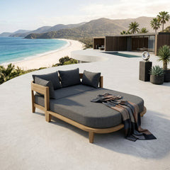 Outdoor patio daybed by Anderson Teak with plush cushions, available in nine designer colors, perfect for garden lounge relaxation.