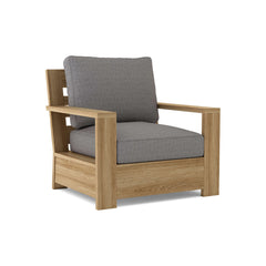 Anderson Teak Madera Deep Seating Accent Armchair in various designer colors, featuring a stylish wooden frame and plush cushions.