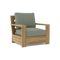 Anderson Teak Madera deep seating accent armchair in one of nine designer colors, showcasing a stylish wooden frame and comfortable cushions.