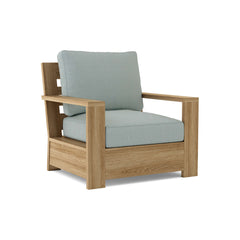 Anderson Teak Madera deep seating accent armchair in 9 designer colors, showcasing a stylish wooden frame and plush cushions.