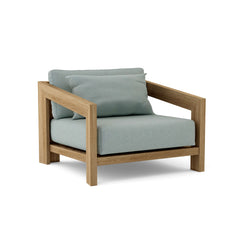 Anderson Teak Smyrna Lounge Armchair in cast pomegranate, outdoor teak accent chair with deep seating and nine designer color options.