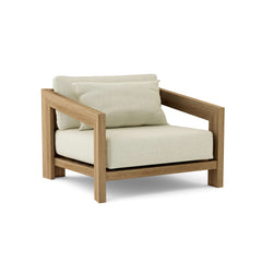 Anderson Teak Smyrna lounge armchair in cast pomegranate, outdoor teak accent chair with deep seating, available in 9 designer colors.