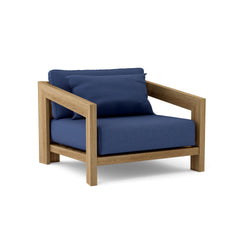 Anderson Teak Smyrna Lounge Armchair in cast pomegranate with teak wood frame, outdoor accent chair, available in 9 designer colors.