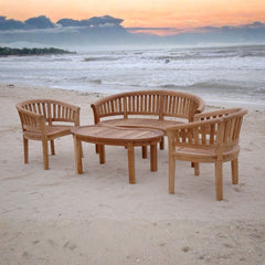Outdoor Anderson Teak bench from the conversation set, featuring a sleek wooden design in natural light with colorful cushions.