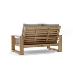 Anderson Teak Capistrano deep seating loveseat in a designer color, featuring plush cushions and stylish outdoor furniture design.