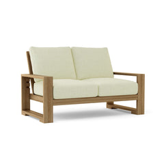 Anderson Teak Capistrano deep seating loveseat in canvas natural, outdoor patio love seat for small spaces with 9 designer colors.