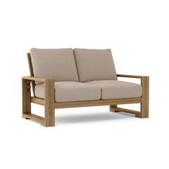 Anderson Teak Capistrano deep seating loveseat for outdoor patio, available in natural canvas and nine designer colors.