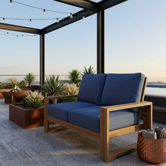 Anderson Teak Capistrano deep seating loveseat for outdoor patio, in natural canvas color, designed for small spaces.