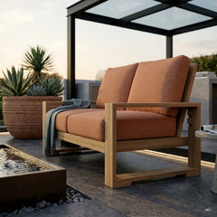 Anderson Teak Capistrano deep seating loveseats for outdoor patio, small space, with natural canvas cushions in 9 designer colors.