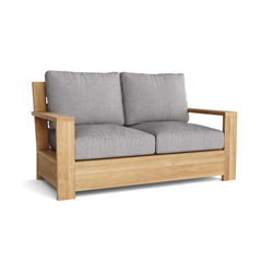 Anderson Teak Madera Deep Seating Loveseat in one of nine designer colors, showcasing a stylish, comfortable outdoor seating option.