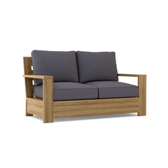 Madera Deep Seating Loveseat by Anderson Teak in one of nine designer colors, featuring plush cushions and a teak wood frame.