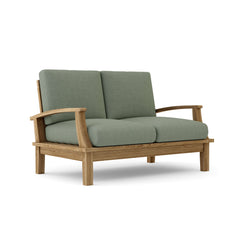 Anderson Teak Brianna deep seating loveseat in vibrant designer colors, featuring plush cushions and sleek wooden frame.