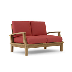 Anderson Teak Brianna deep seating loveseat in one of nine designer colors, showcasing plush cushions and stylish outdoor furniture design.